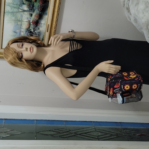 Black with flowers crossbody bag. Canvas holds bottle water. - Picture 6 of 8